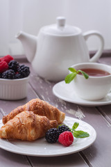 European breakfast tea coffee milk croissant fresh berries morning