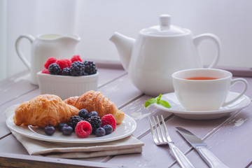 European breakfast tea coffee milk croissant fresh berries morning