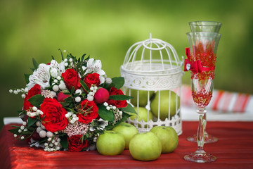 green apples and glasses on table
