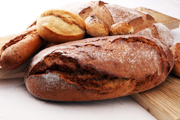 bakery concept with bread and bread rolls on white background.