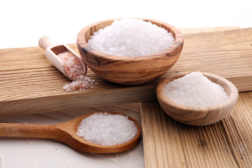 differnt kind of salt in wooden bowl and spoon.