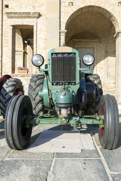 Old vintage farm tractor. Color image