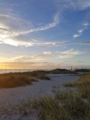 Orange Sunset with Clouds and Beach Grasses