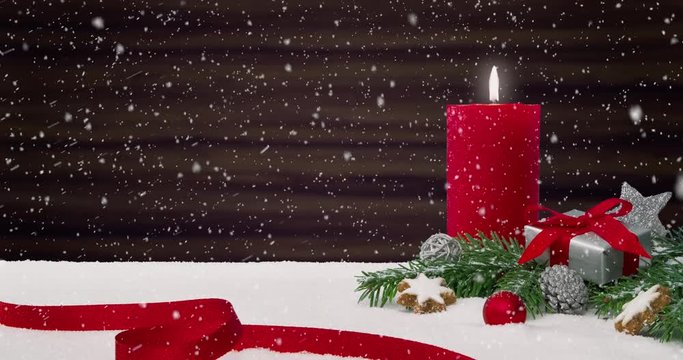 Seamless loop of a beautiful snowfall in front of a Christmas decoration arrangement on a snowy table in front of a wooden background - ProRes