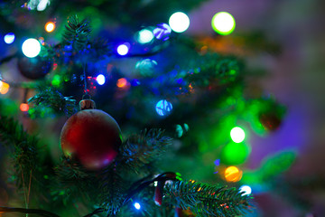 Obraz na płótnie Canvas Decoration on a Christmas tree with lights.
