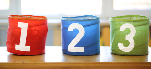 three colorful play jars with numbers