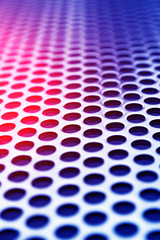 chrome metal round mesh cut-off close-up with blurred background