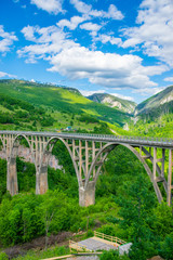 Fototapeta na wymiar The Djurdjevic Bridge crosses the canyon of the Tara River in the north of Montenegro.