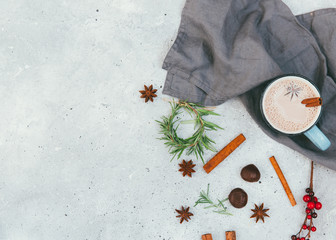 Christmas natural decorations and hot chocolate over vintage table. Holiday background. Copy space