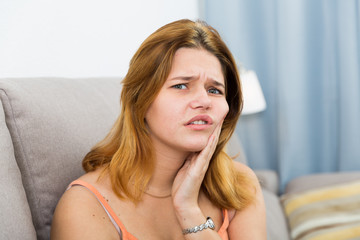 Sick girl have strong pain in tooth