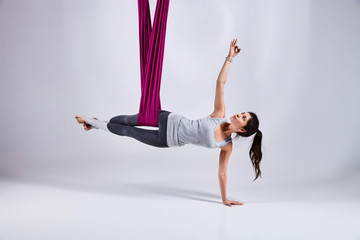 Aerial different inversion yoga in a hammock