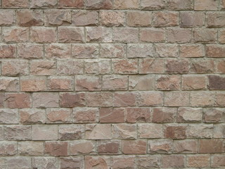 Background beautiful stone walls. A wall of decorative building stone.