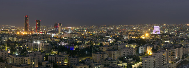 Panoramic view of Amman's new downtown at night - obrazy, fototapety, plakaty
