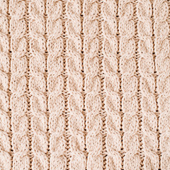 Beige knitted wool texture pattern.