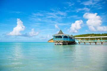 Pier with wooden shelter in sea in st johns, antigua