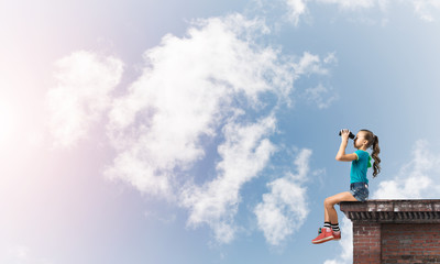 Concept of careless happy childhood with girl of school age looking in future