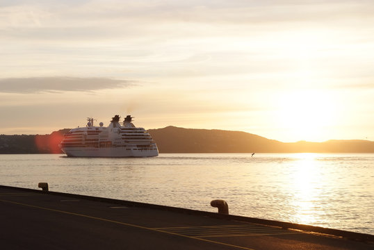 Passenger ship in sunset sea in Bergen, Norway
