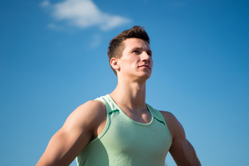 Athlete in green tshirt on sunny day