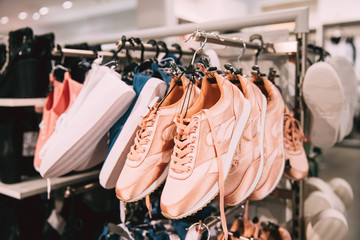 Close View Of Fashion Casual Female Sneakers On Hunger In Store 