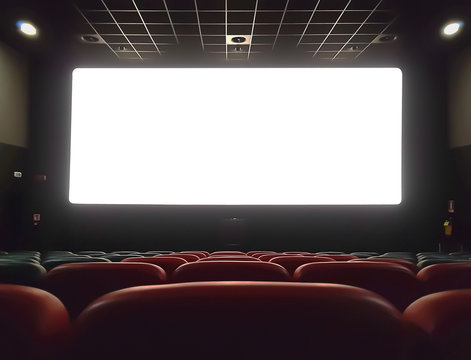 cinema interior of movie theatre with empty red and black seats with copyspace on the screen and glow on edge, concept of recreation and entertainment