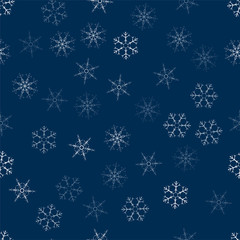 abstract seamless pattern made of snowflakes on blue. Christmas background for design of posters, postcards, invitation for the new year.