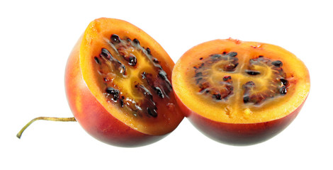 Tamarillo (tree tomato) fruit cut in half isolated on white background