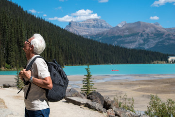 Old man hiking at lake Louise