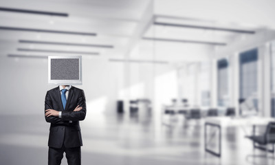 Businessman with monitor instead of head.