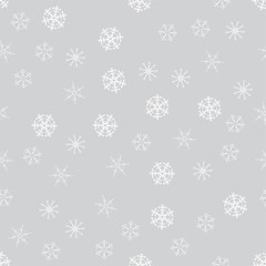 seamless pattern from white snowflakes on the grey background. Texture for cards, greeting, Christmas, new year, holiday, party