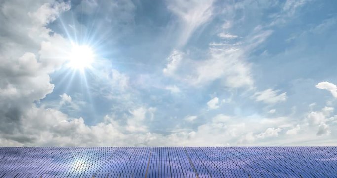 Solar panels on the beautiful cloudy sky, time laps