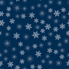 abstract Christmas seamless pattern from white snowflakes on a blue background. For holiday, new year, celebration, party.