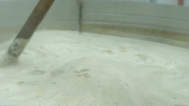 cooking barley grains for producing beer at the brewery.
