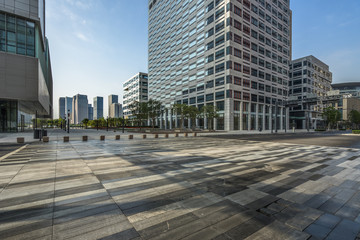 Fototapeta na wymiar modern glass building exterior with empty pavement