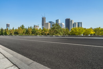 Fototapeta na wymiar cityscape and skyline of tianjin from empty asphalt road