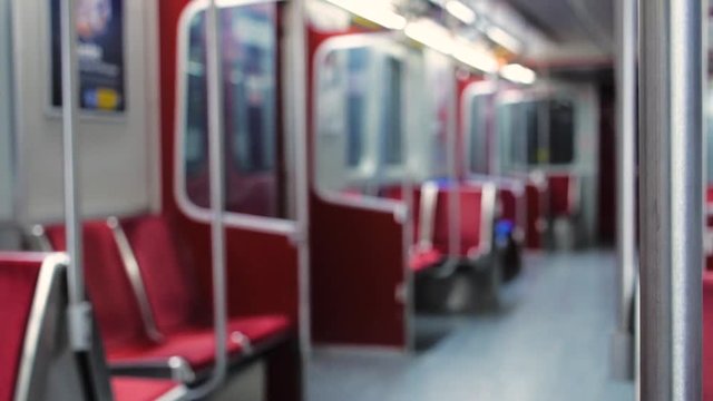 Shallow focus shot of the safety bar on an empty subway car