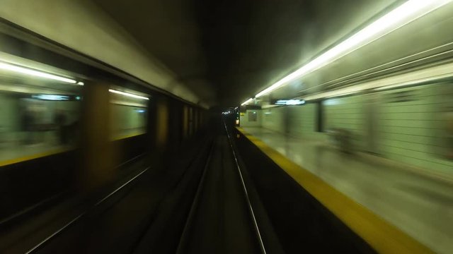 Timelapse of subway travelling past multiple stations in Toronto