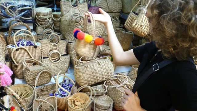 Woman Shopper Buying Wicker Basket Bag In Bag Store. Hot Trend. 4K. 
