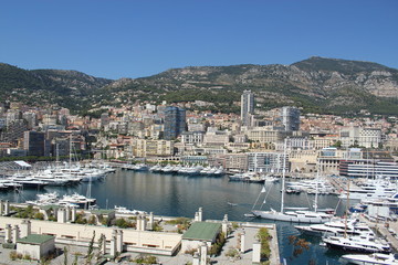 Fototapeta na wymiar view of the port in Monaco and coastline with boats and buildings