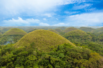 Chocolate Hills with blue sky in the green season, Bohol, Philippines