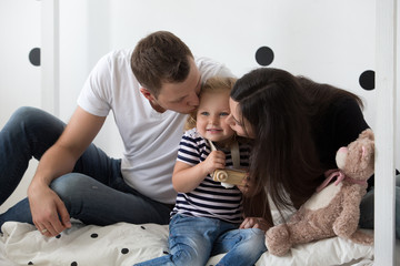 Young family, mother, father and daughter are playing together. Family, relationships, family values, portrait.