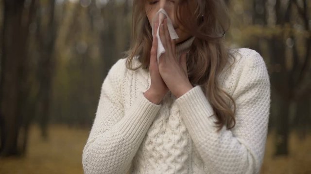 Young girl suffering from importunate rhinitis and coryza, seasonal allergy