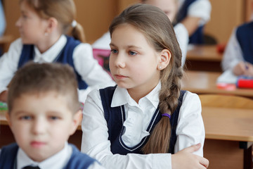 A student in the classroom listens carefully
