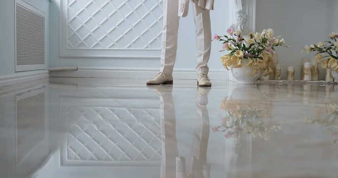 groom tunes his jacket