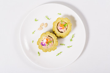 Boiled bitter gourd with pork decorated with carrot and flower,food styling.Top view of food