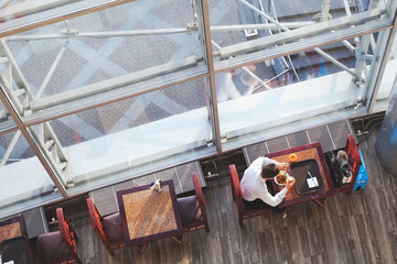 business lunch, top view of businessman eating in cafe, high angle of canteen for employees