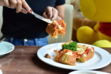 knife cut bread and cheese.