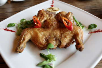 Chicken tobacco on white plate