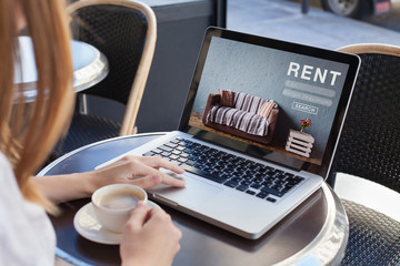 rent online concept, woman using internet website for rental apartments, houses and flats - obrazy, fototapety, plakaty