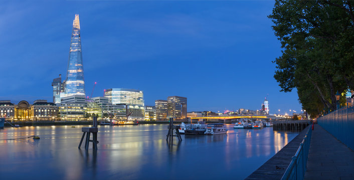 London - The panorama of Thames riverside and Shard from promenade at dusk.