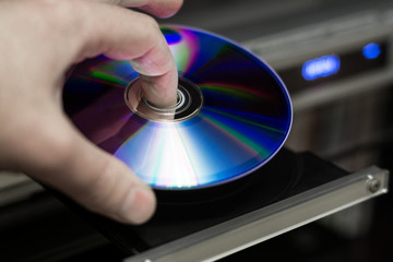 DVD disc inserting to player